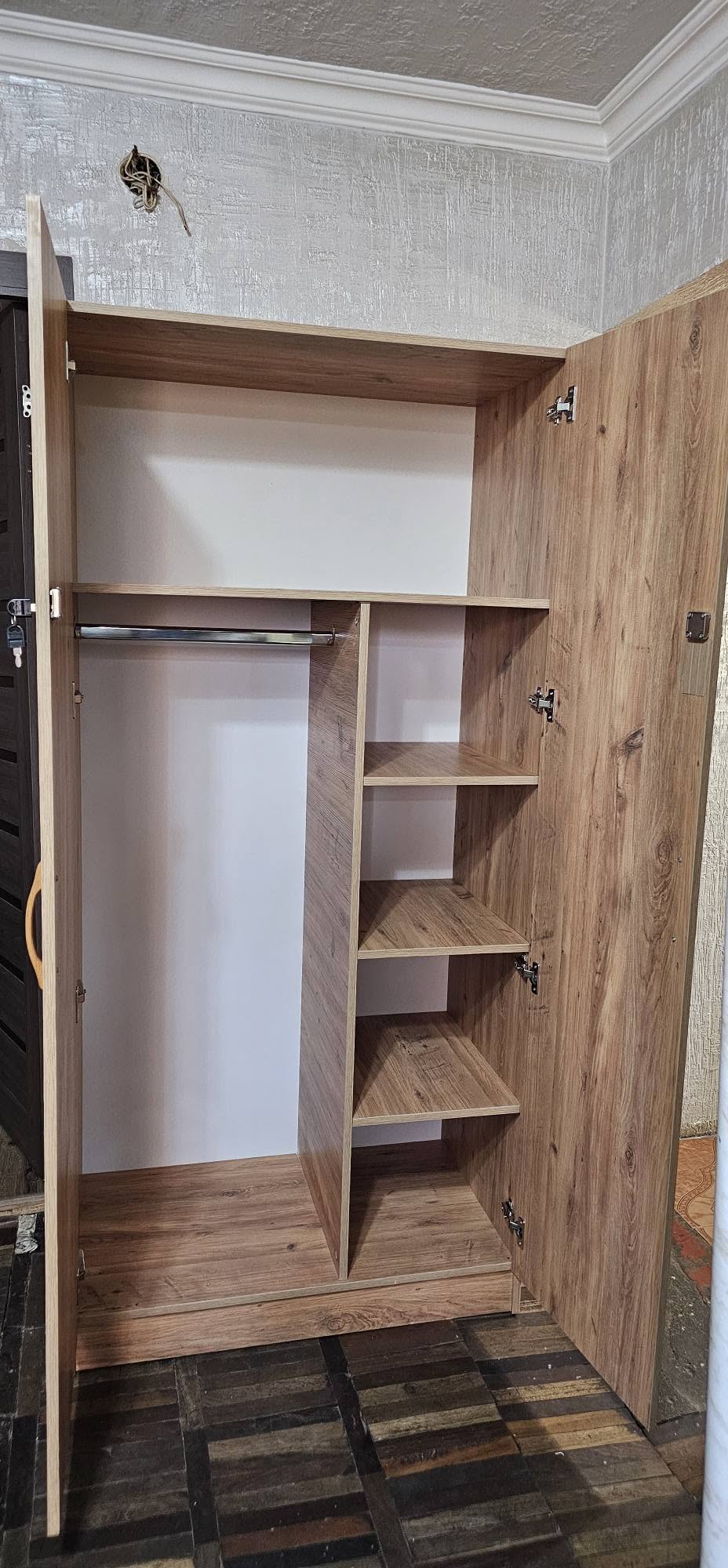 Wardrobe with shelves and hanging rail