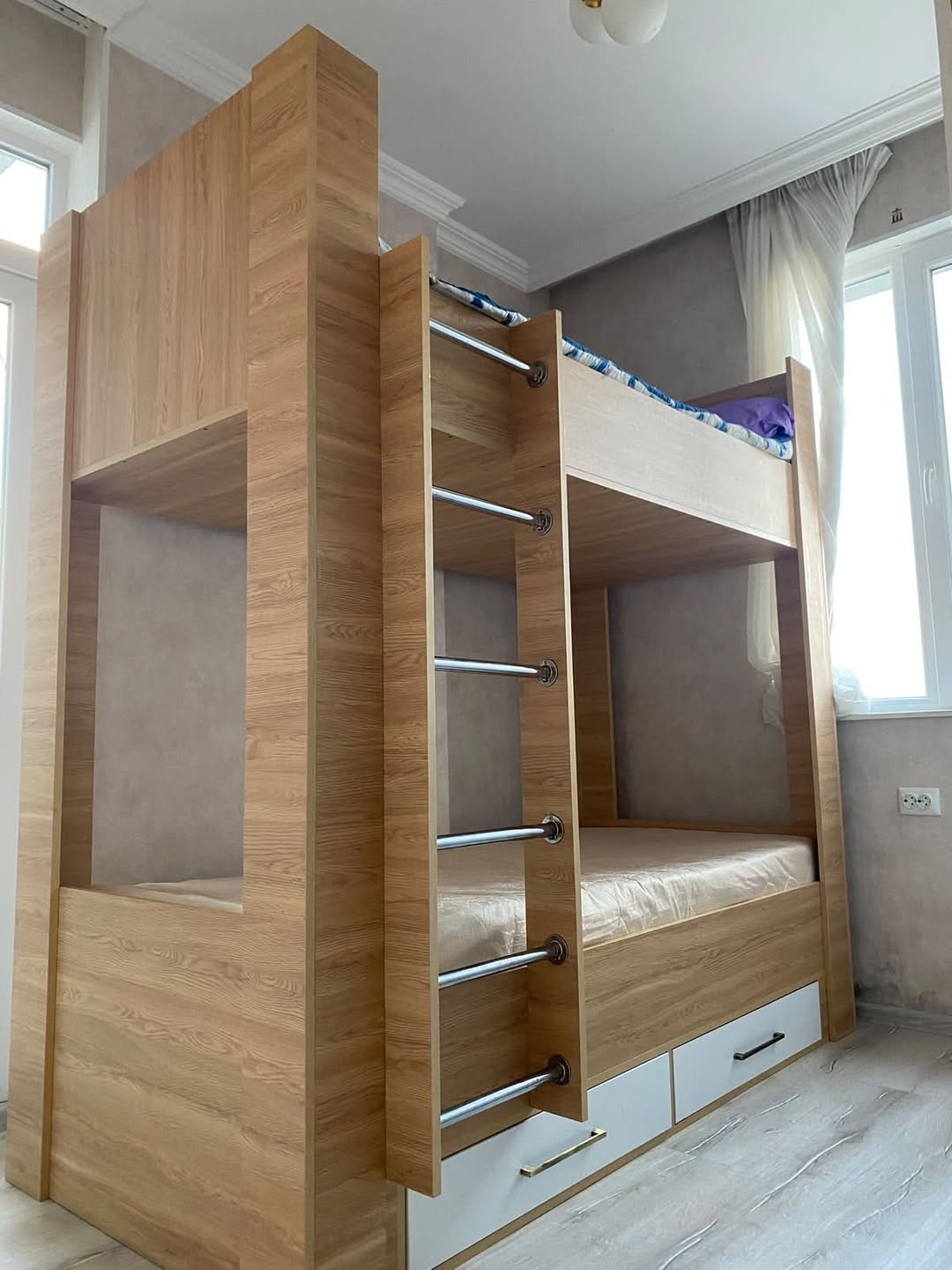 Wooden bunk bed with drawers