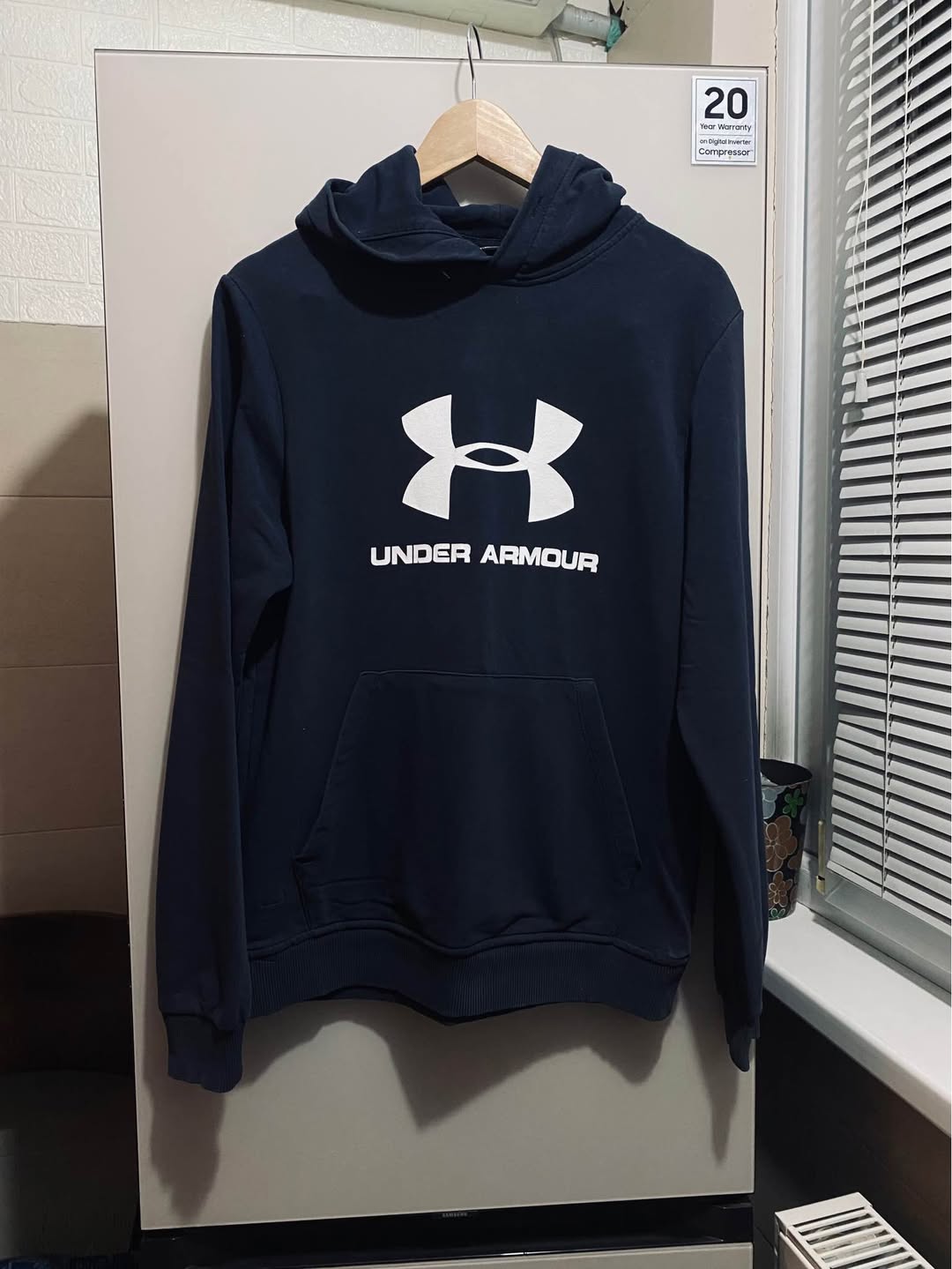 Navy Under Armour hoodie with white logo