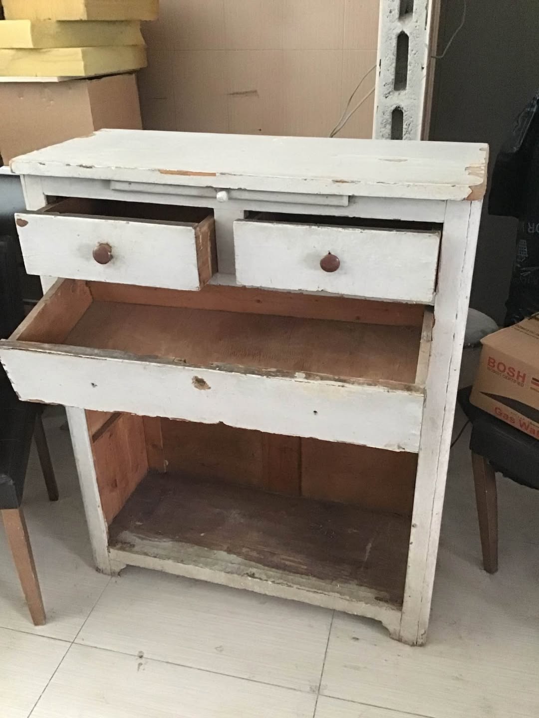 White wooden cabinet with drawers