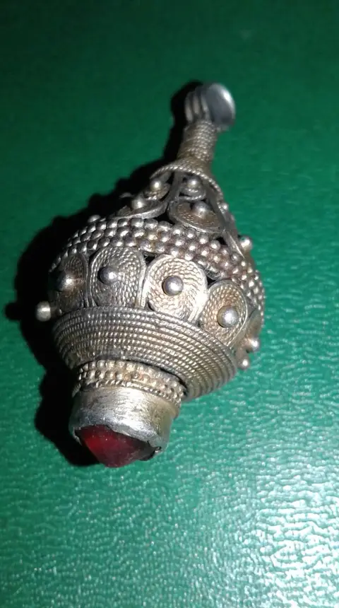 Antique Dagestani silver pendant with red stone