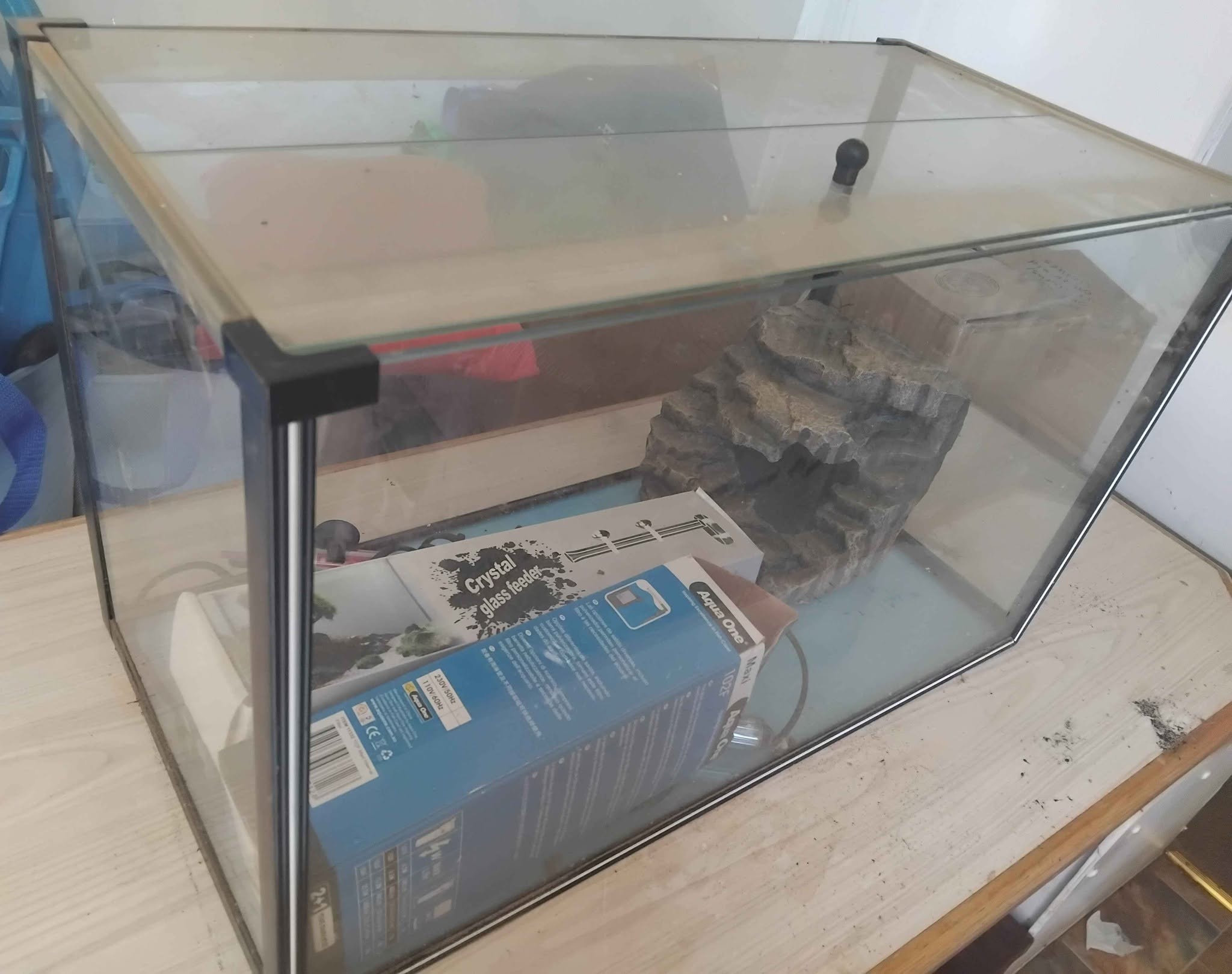 Medium fish tank with rock decor and heaters