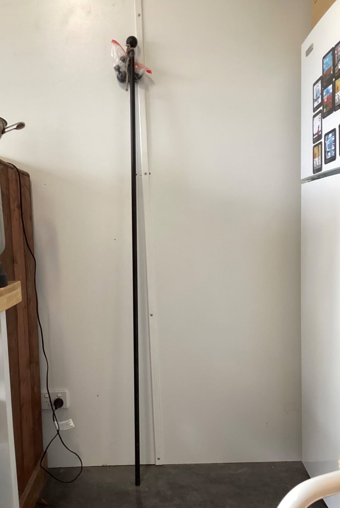 A metal curtain rod with ball