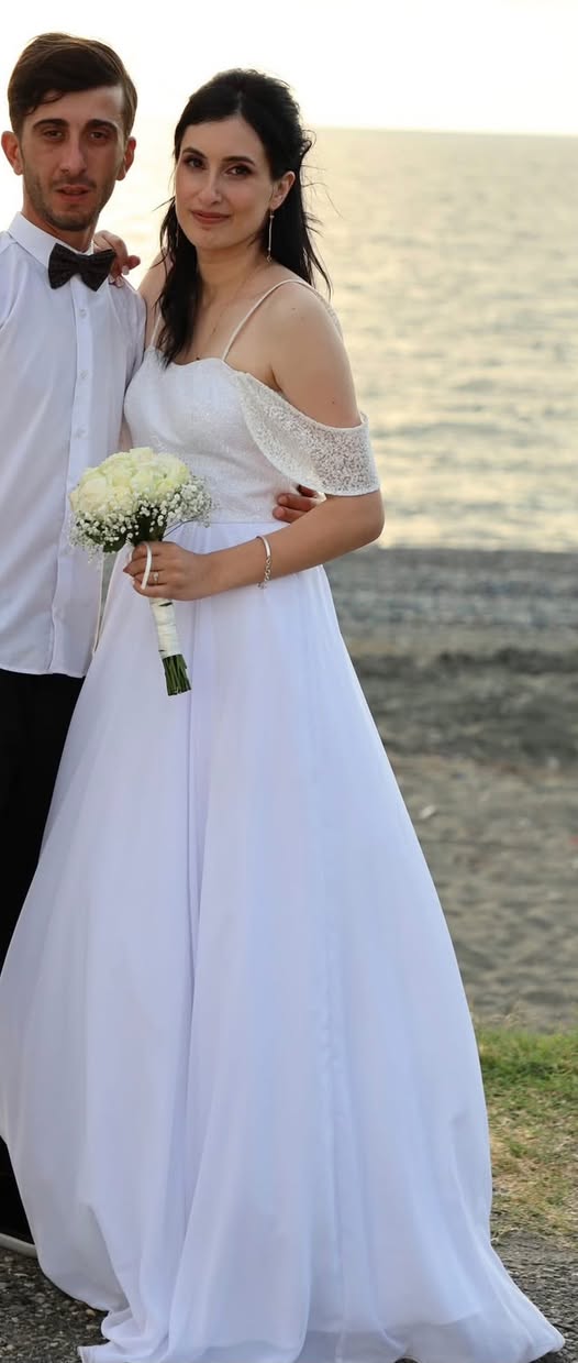 For sale is a beautiful white wedding dress