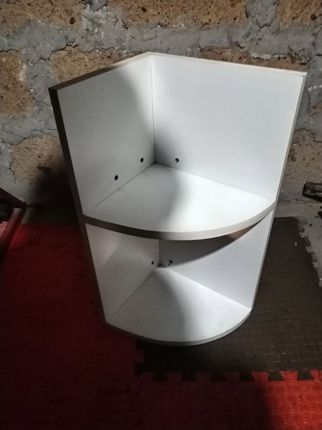 White two-tier corner shelf unit