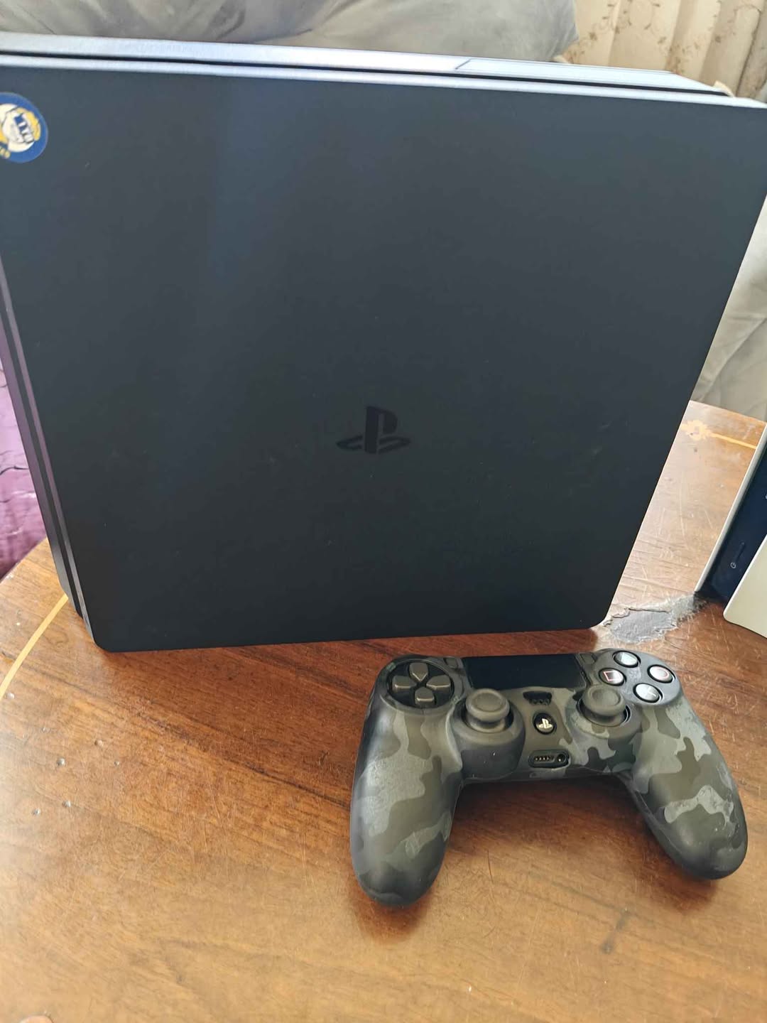 PlayStation 4 console with controller
