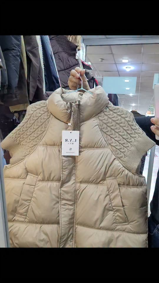Beige padded vest with knit shoulders