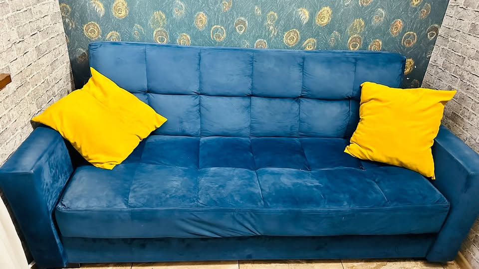 Blue velvet sofa bed, 2 m wide