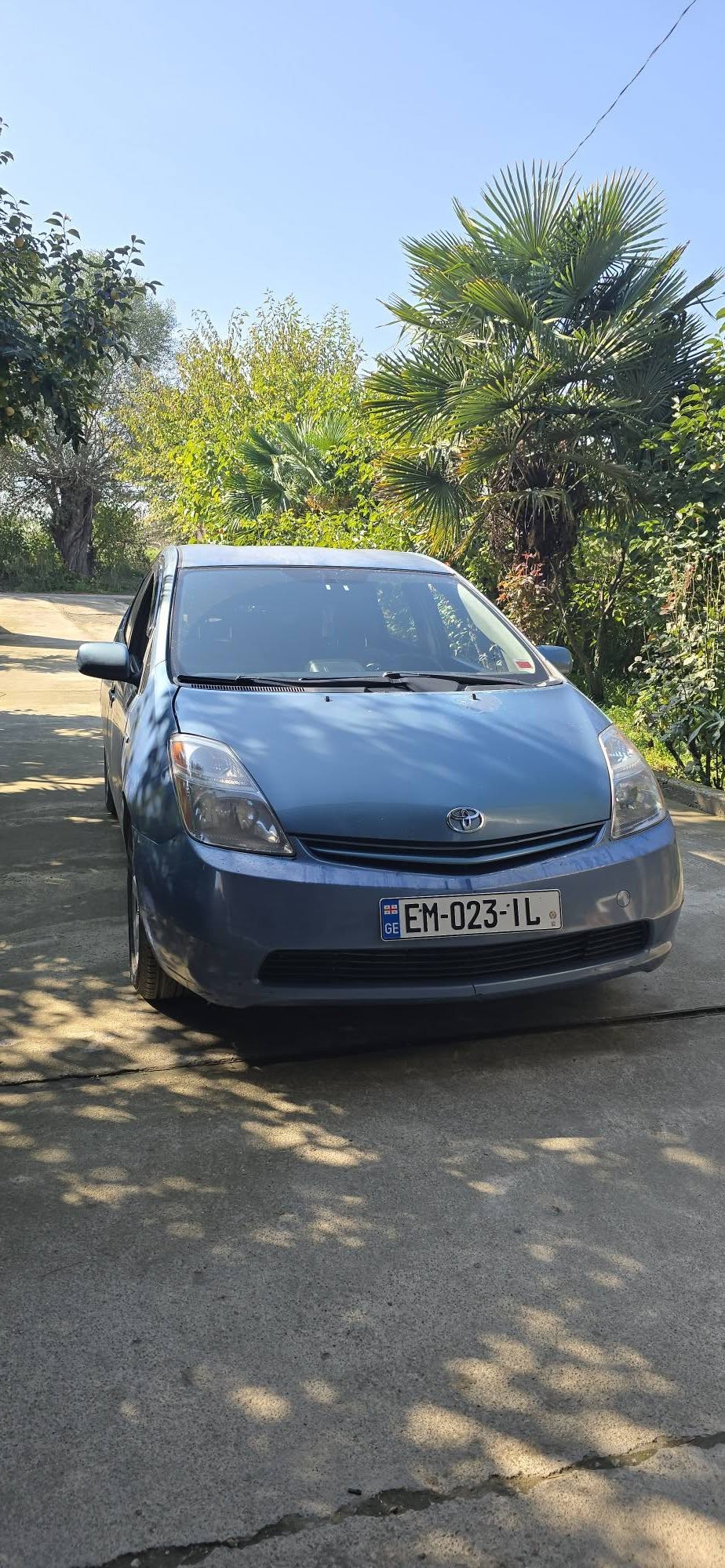 Blue Toyota Prius hatchback