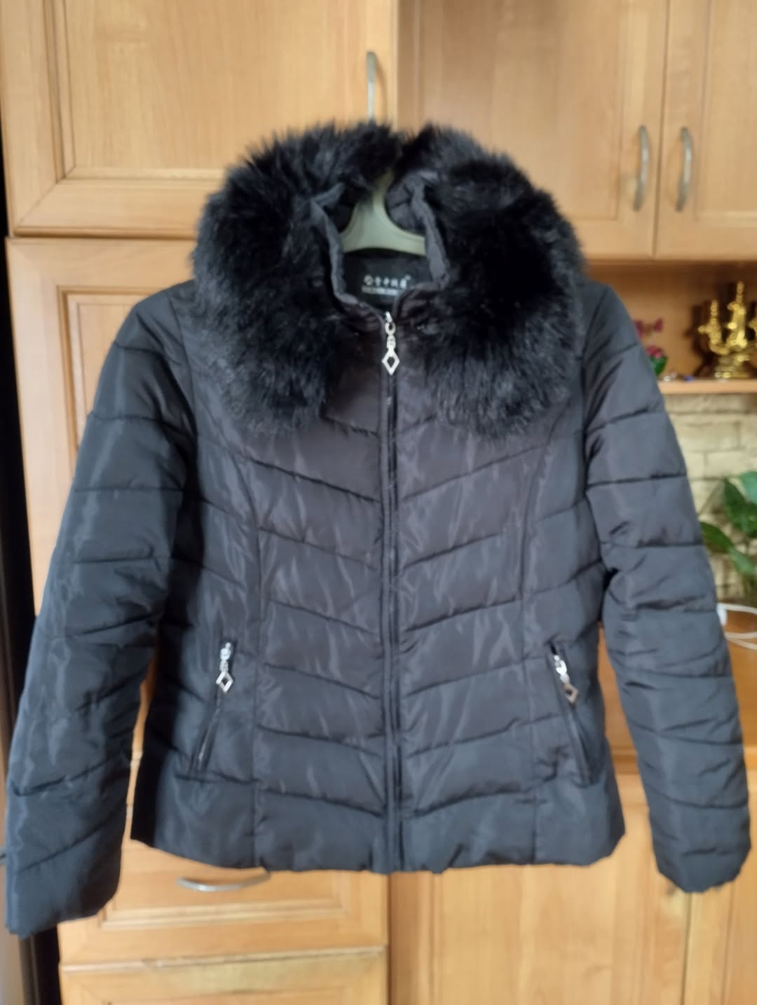Women's black down jacket with fur collar