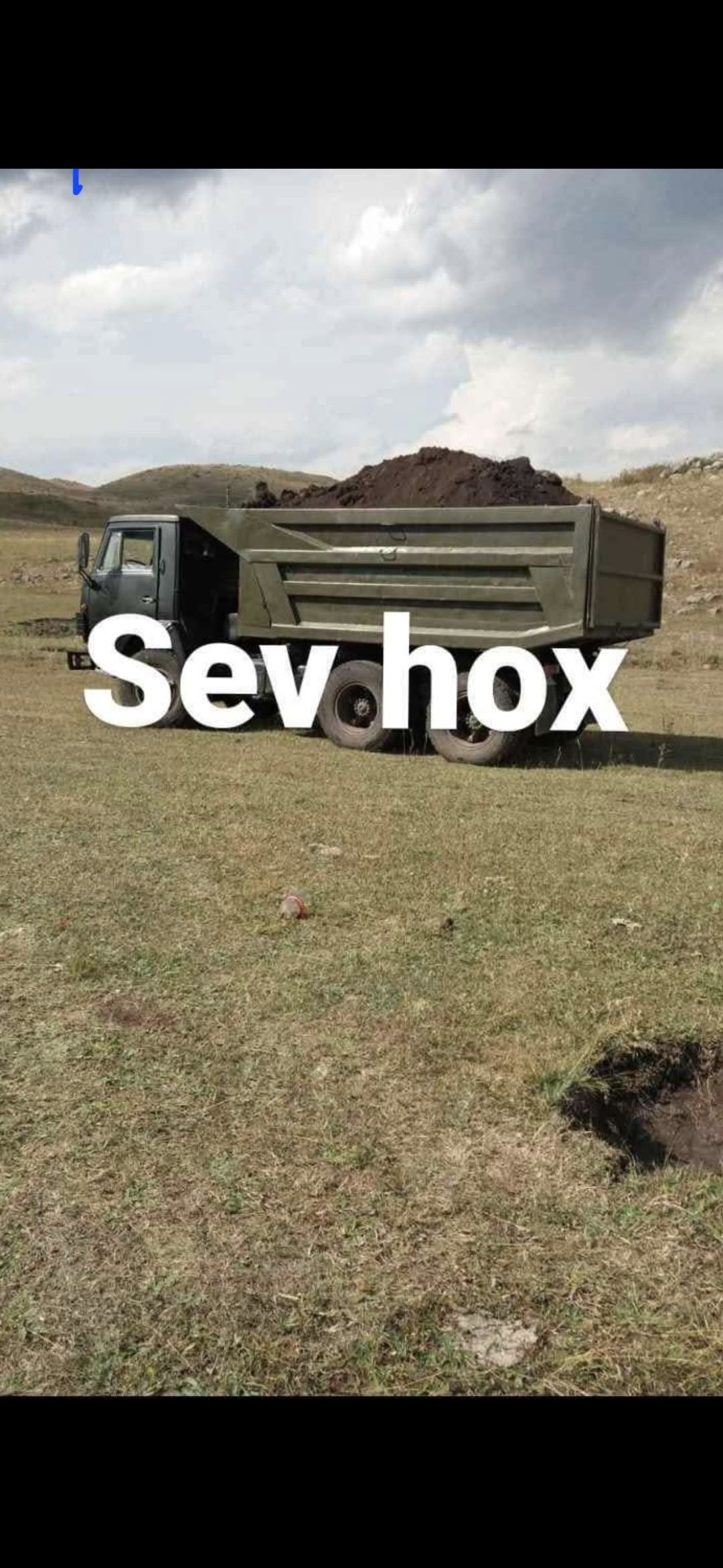 Black soil delivery by dump truck