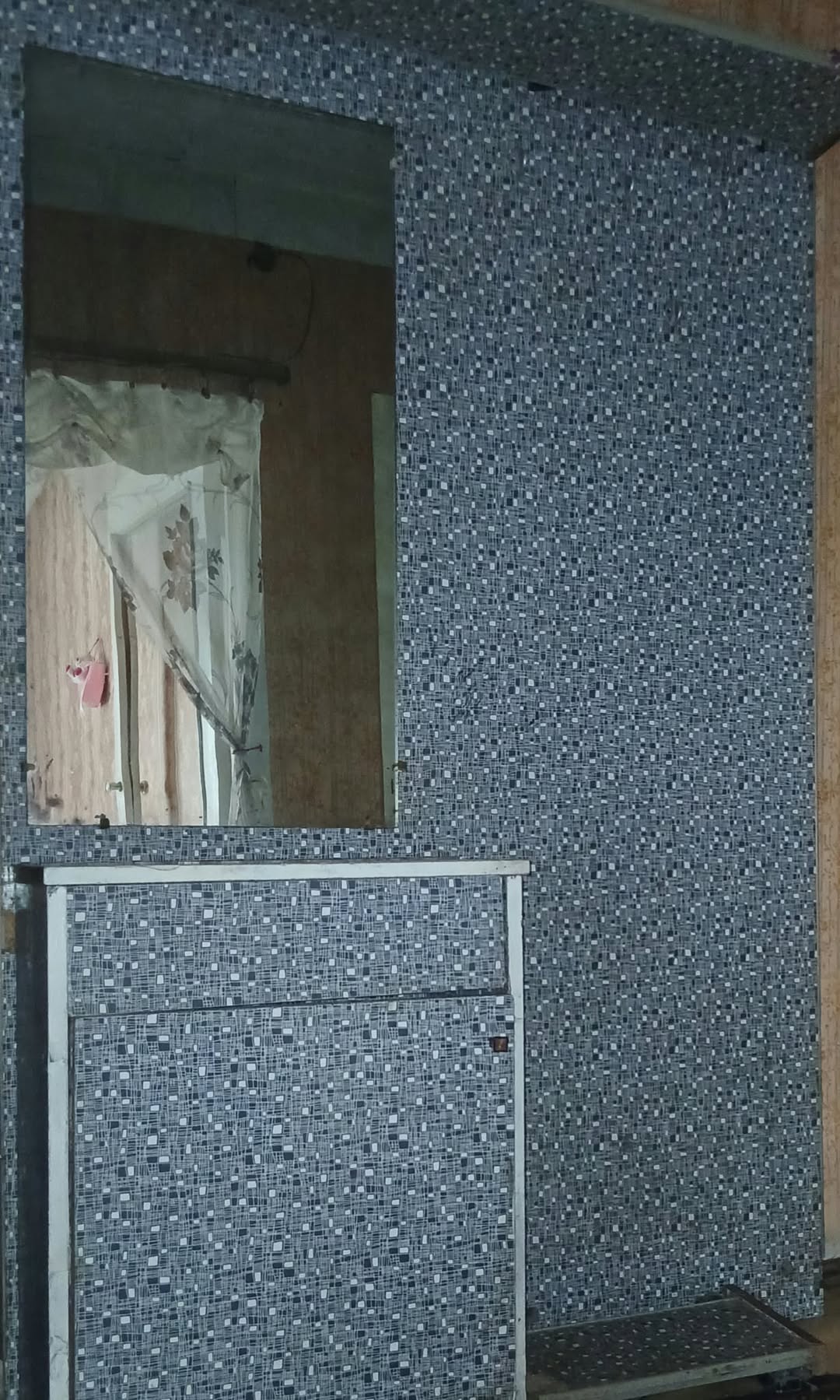 Hallway closet with mirror
