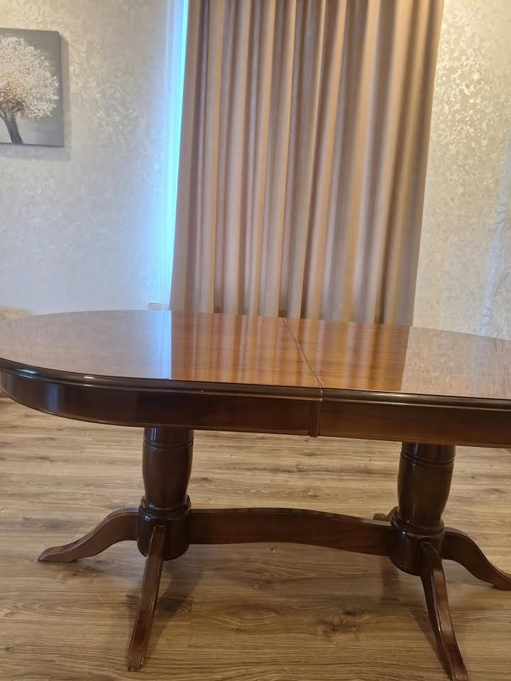 Oval wooden dining table