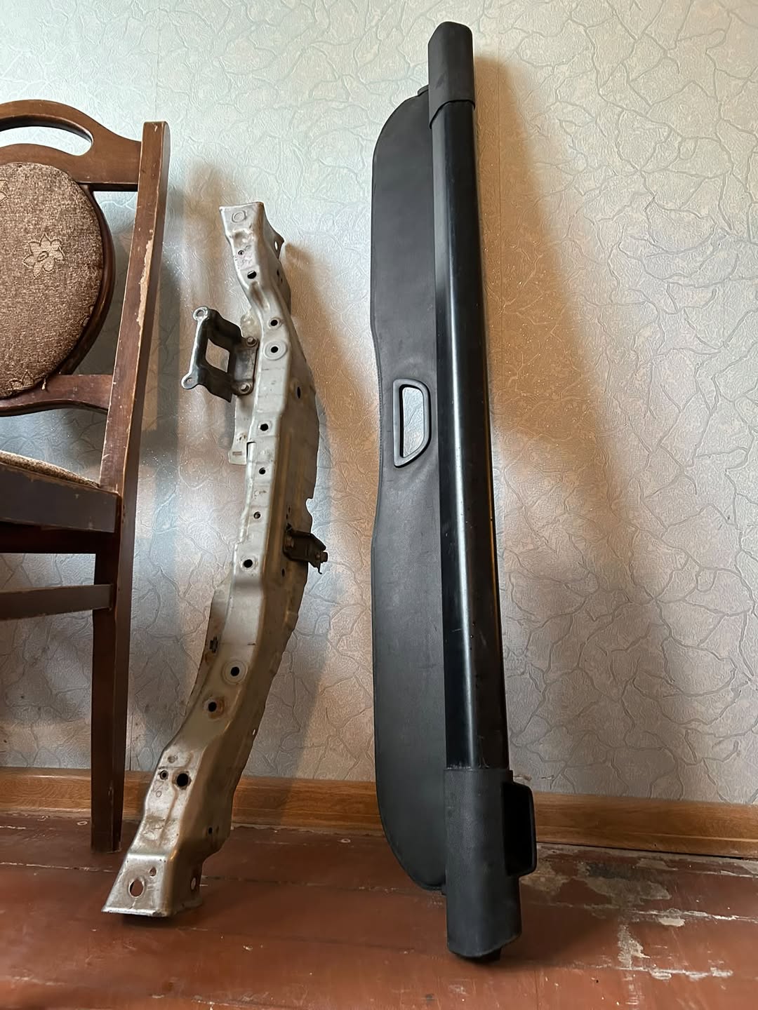 Two car parts: trunk cover, metal beam
