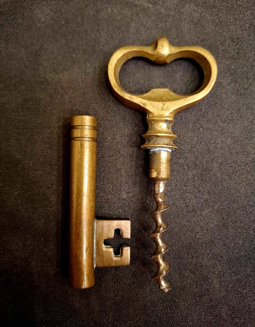 Vintage brass corkscrew and key