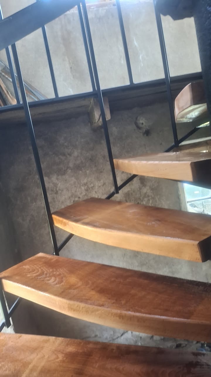 Wooden staircase with steel railings