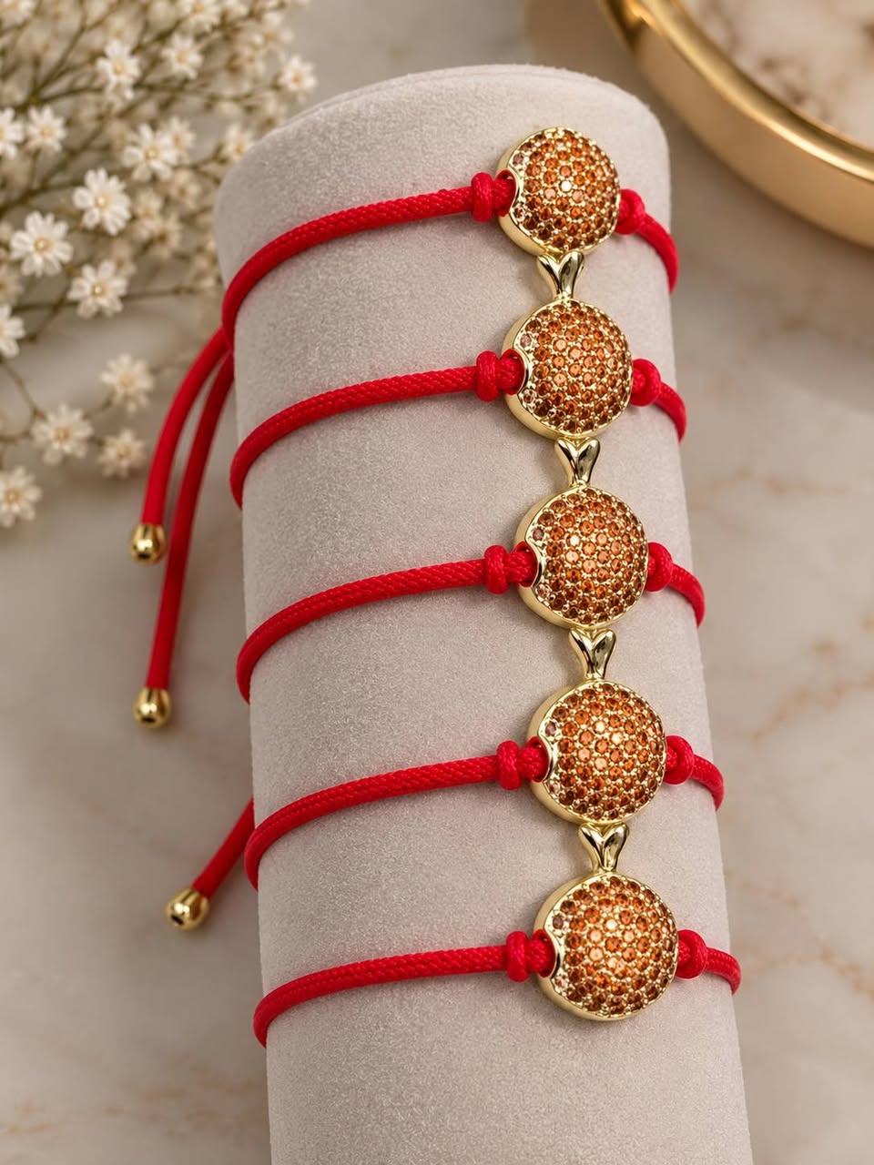 Gold-plated red cord bracelets