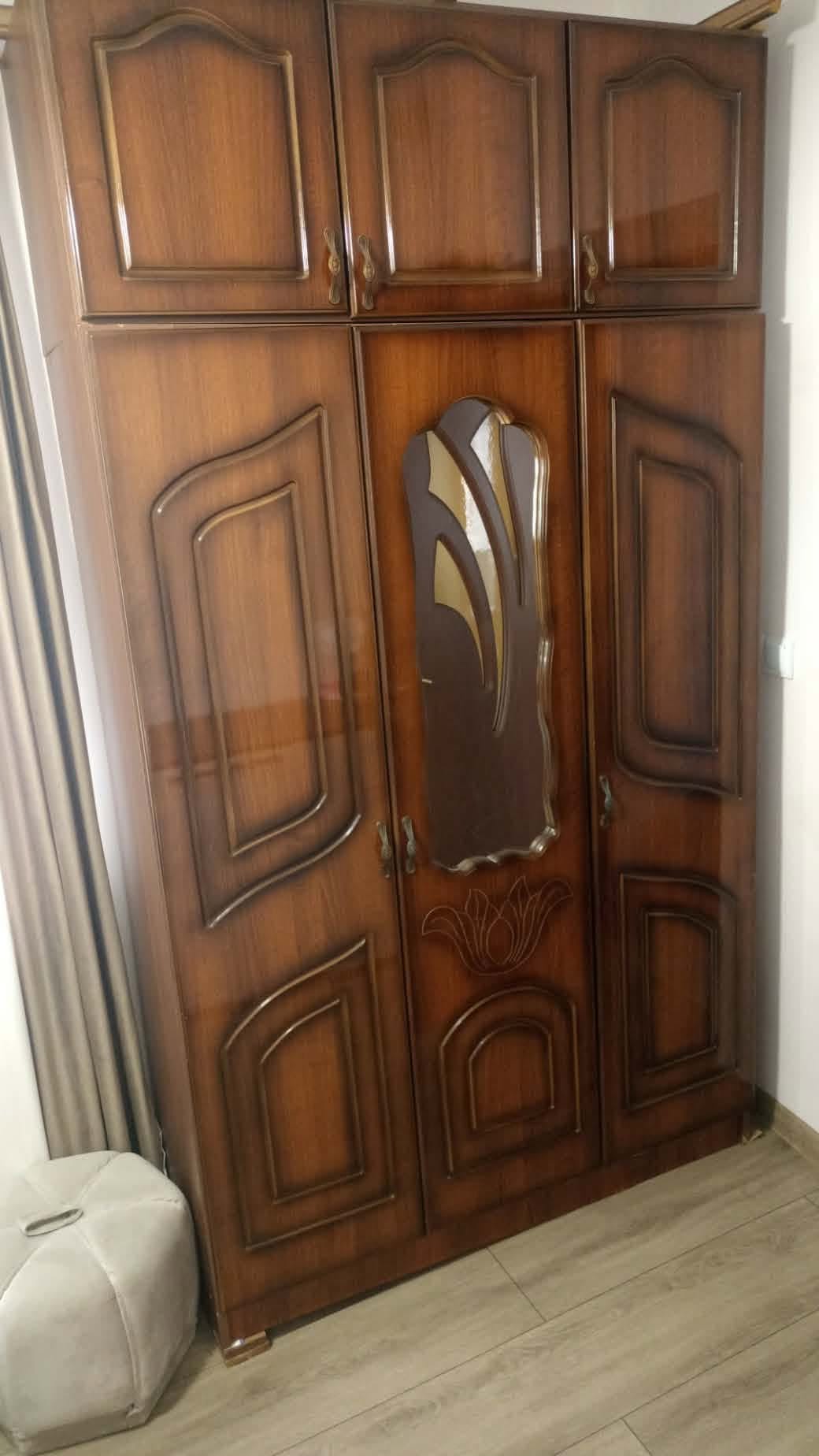 Brown wooden wardrobe with mirror