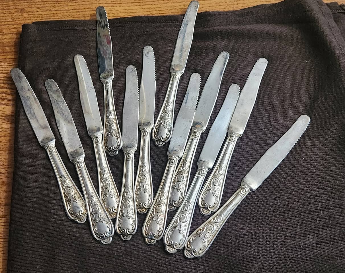 12 Italian table knives, silver handles