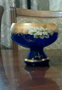 Blue glass bowl with gold rim and flowers