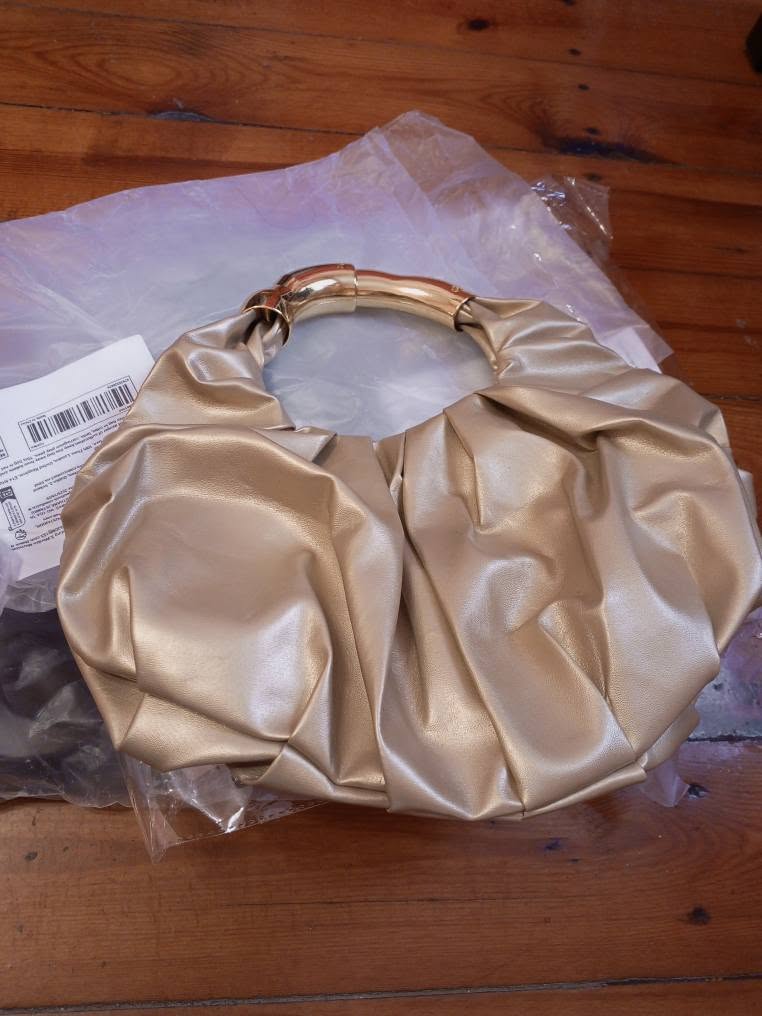 New golden bag, in package