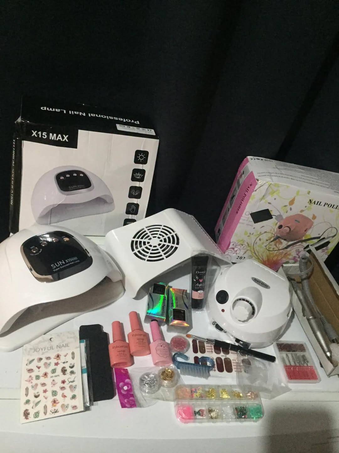 Professional nail kit: UV lamp, drill, gels