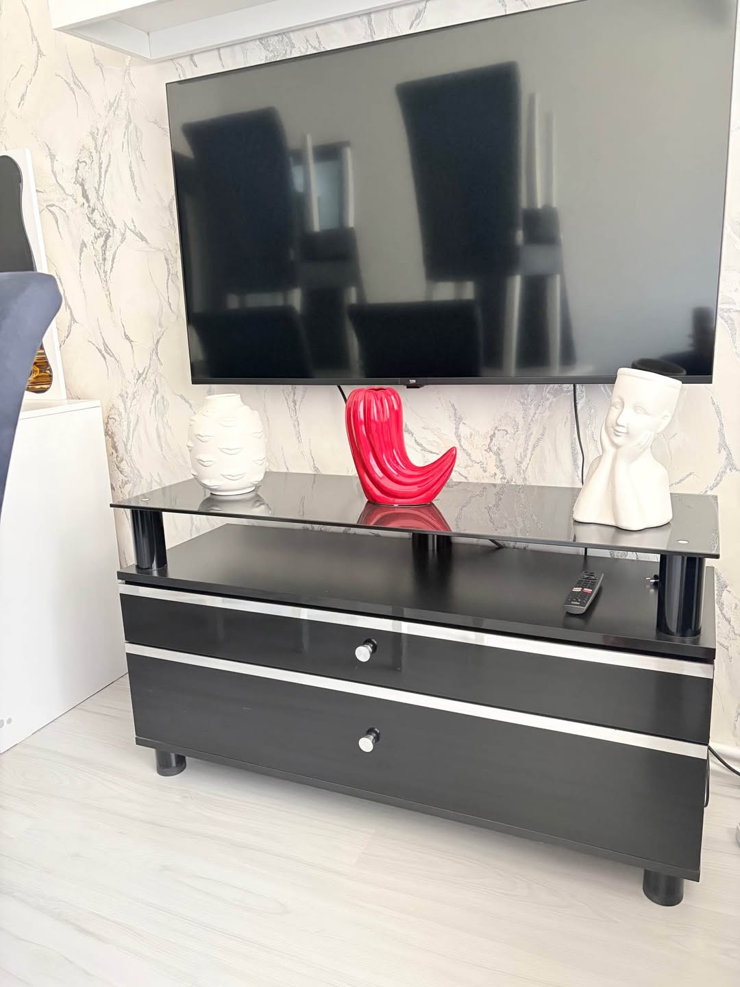 Black TV stand, glass shelved