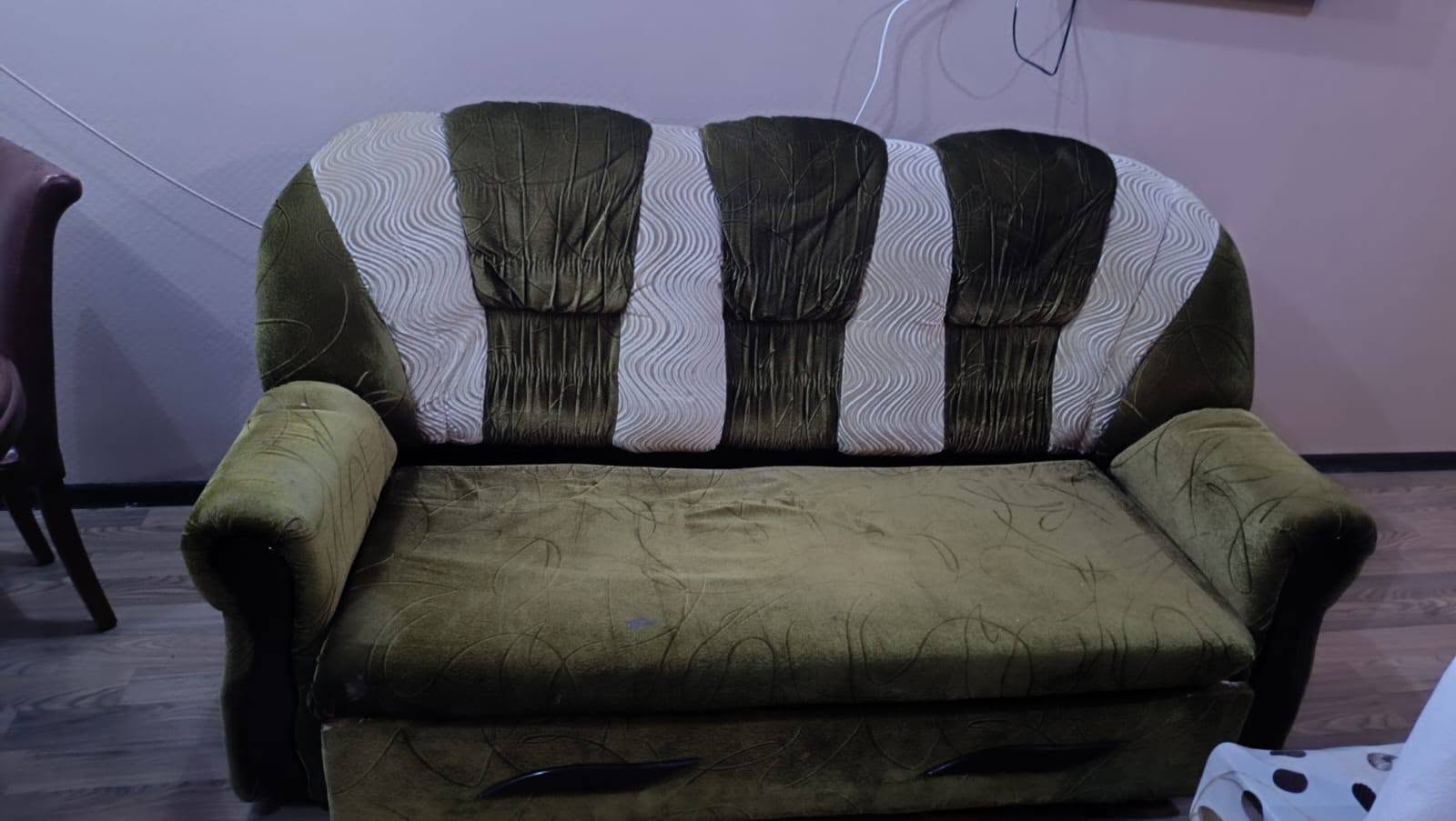 A sofa and one armchair are being given away. Table