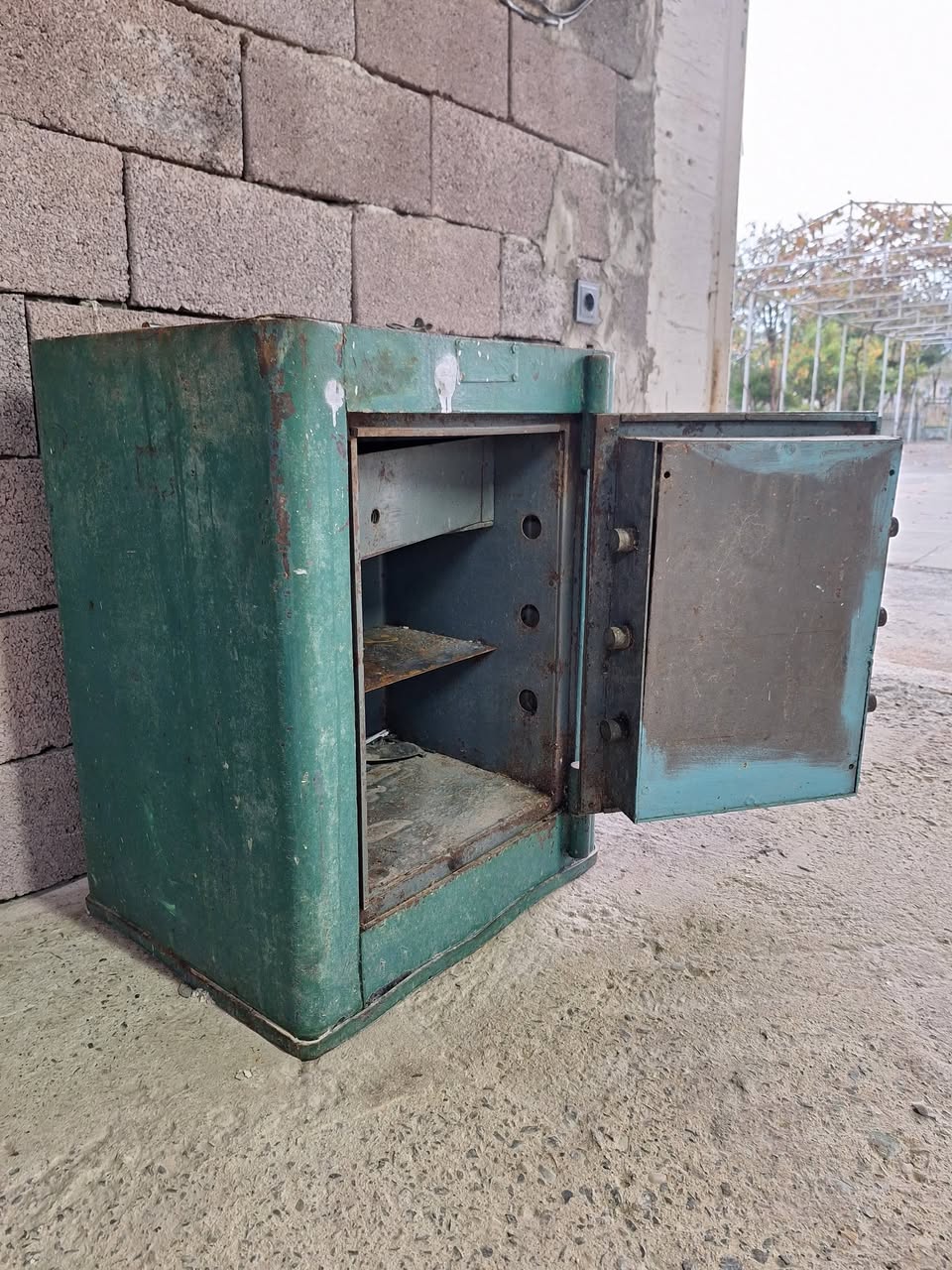For sale is an old, heavy iron safe