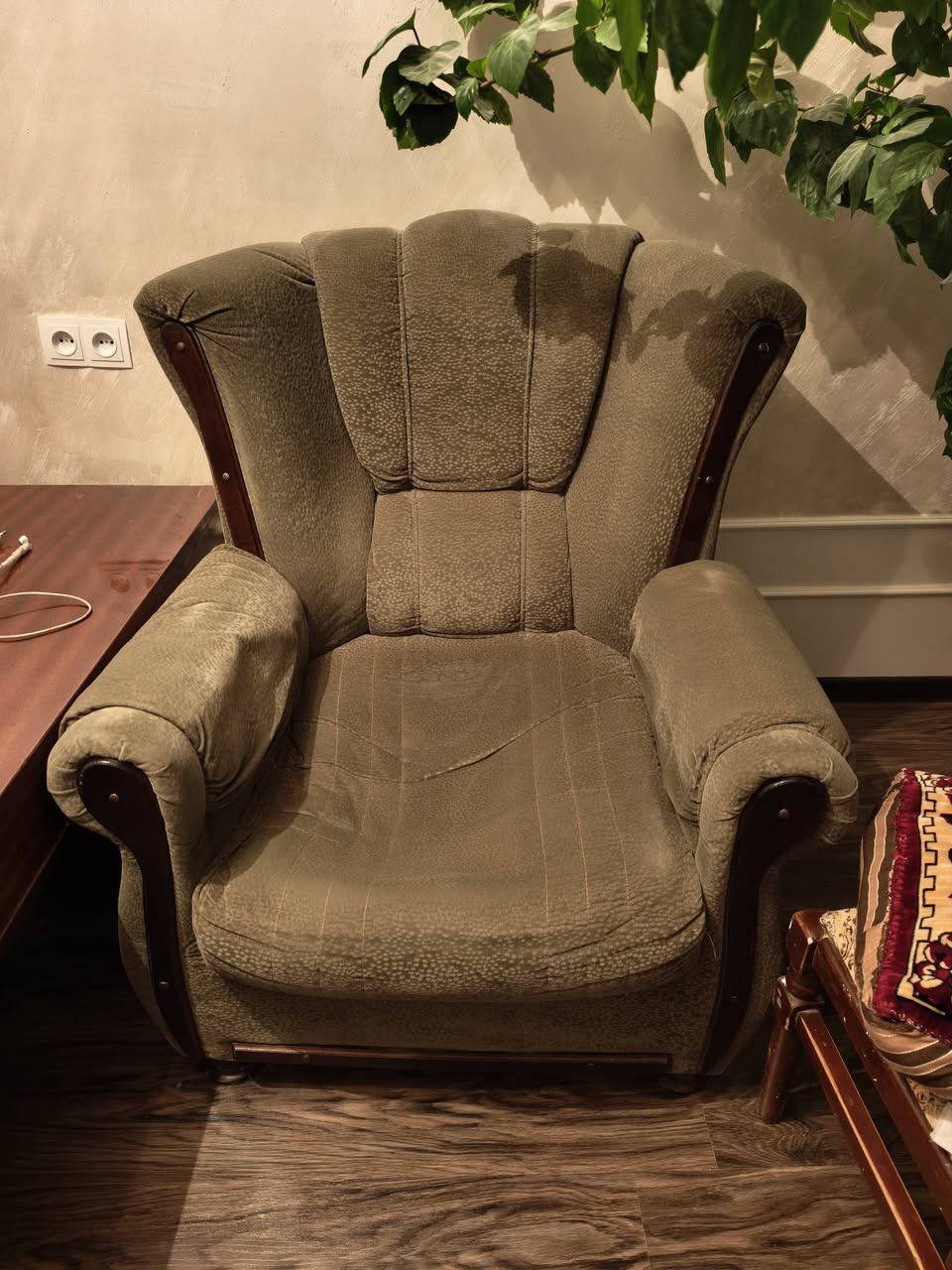 Beige fabric armchair with wooden trim
