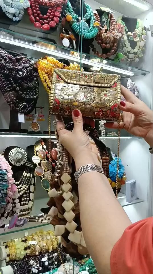 Ornate metal handbag with stones