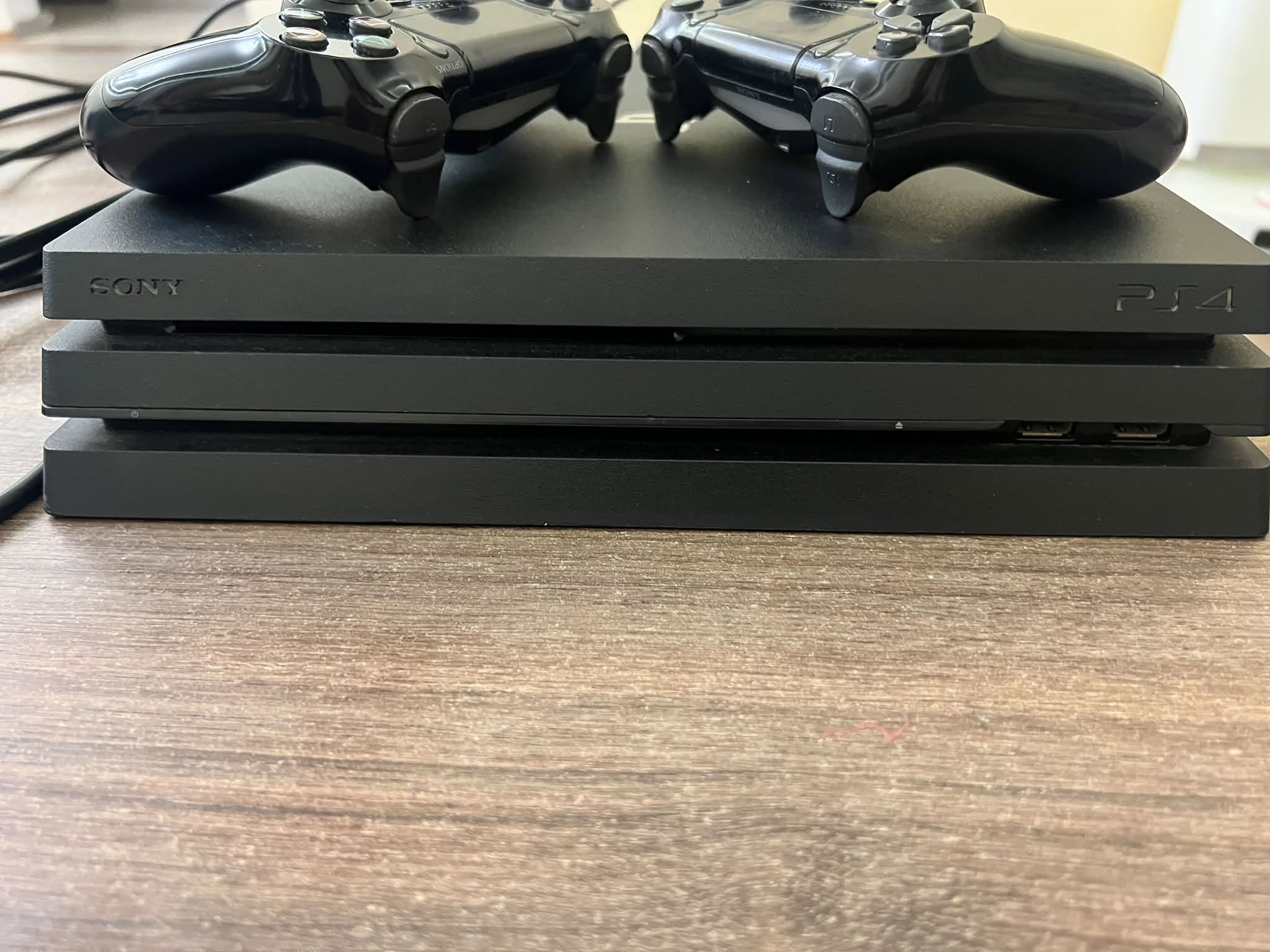 PlayStation 4 Pro, used, with controllers